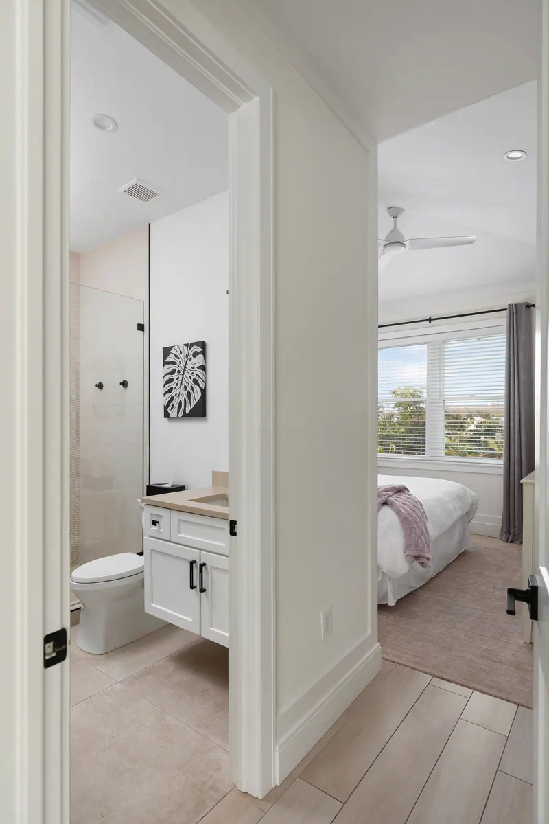 En-suite bath with designer finishes and a glass shower
