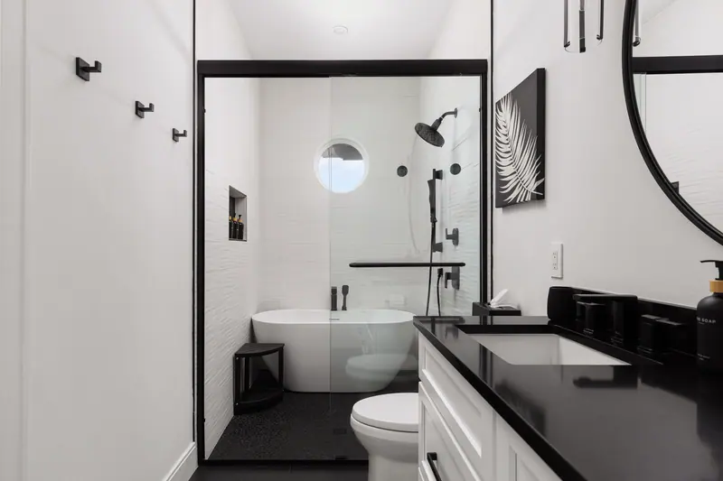 Spa-inspired bath with soaking tub and rainfall shower