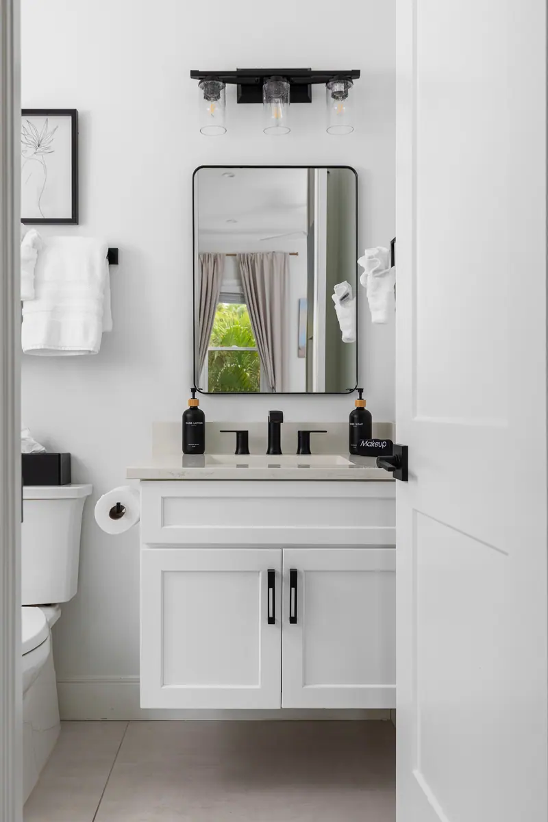 En-suite bath with walk-in shower and matte black fixtures