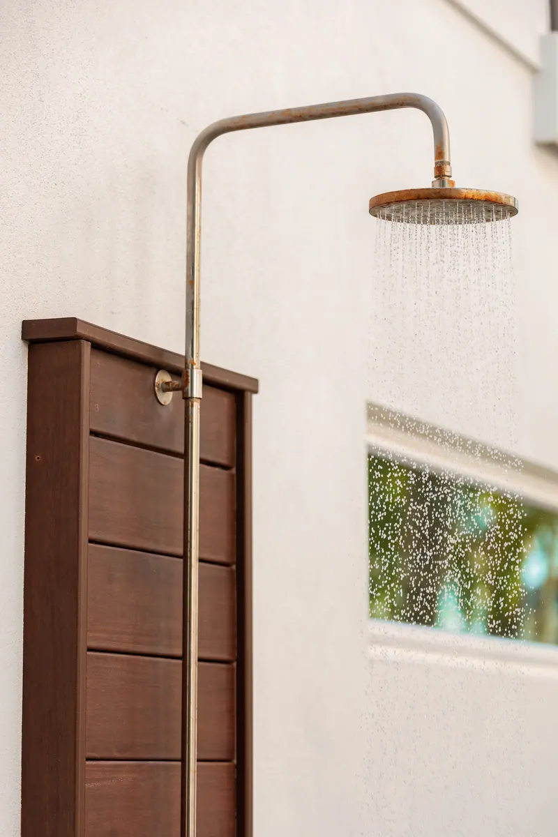 Private outdoor shower for rinsing off after the pool
