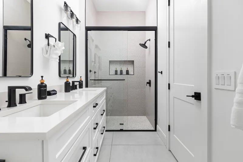 En-suite bath with double vanity and glass walk-in shower