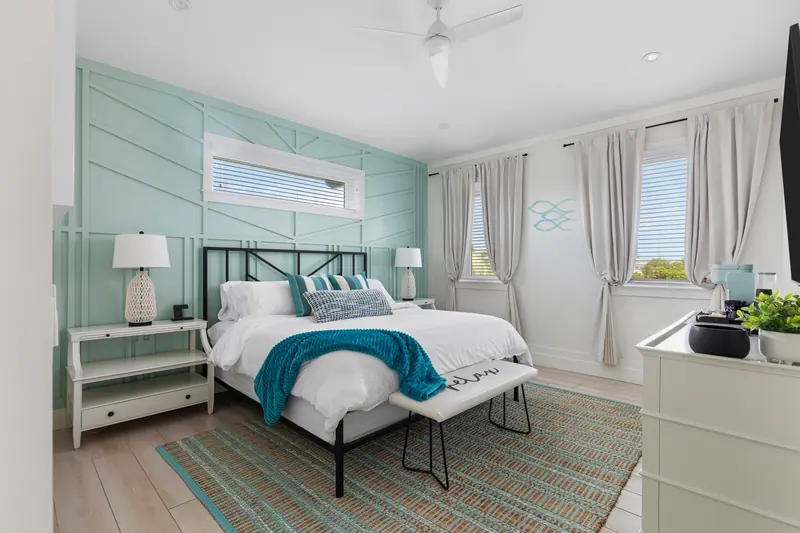 King bedroom, bright and airy, with Roku TV and bedside charging