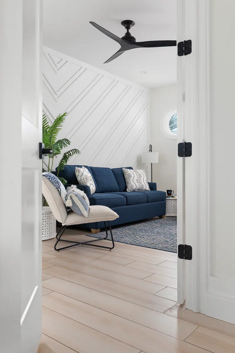 Landing seating area between three bedrooms with Roku TV