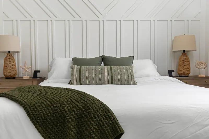 King bedroom with designer accent wall and coastal styling
