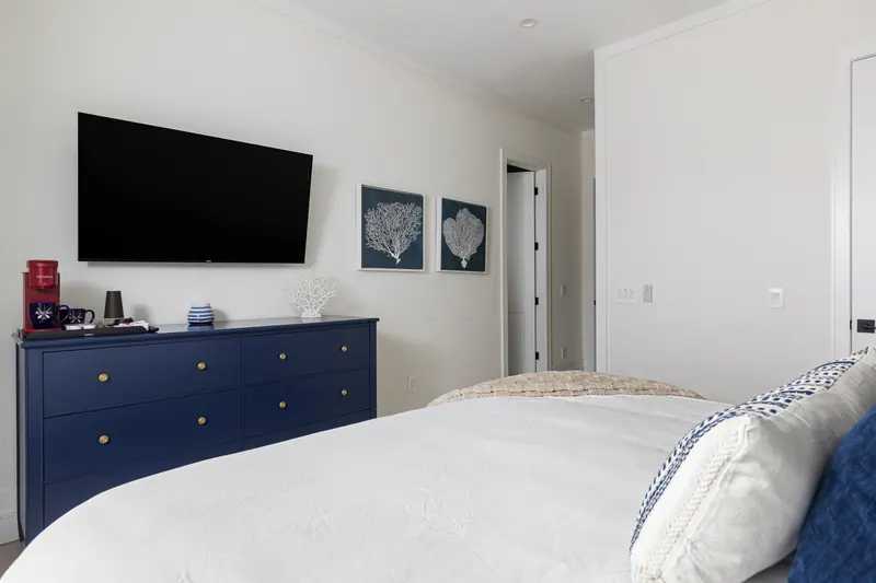 In-room coffee station with smart TV and coastal styling