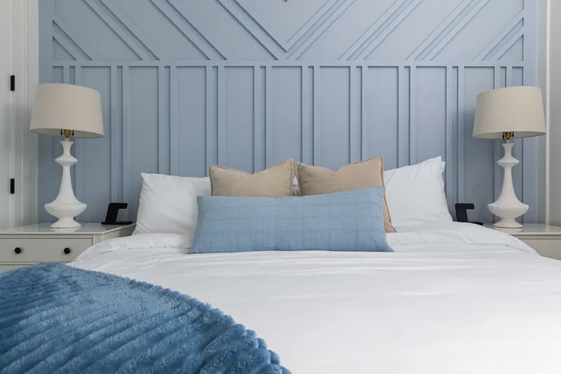 King bedroom with custom blue accent wall